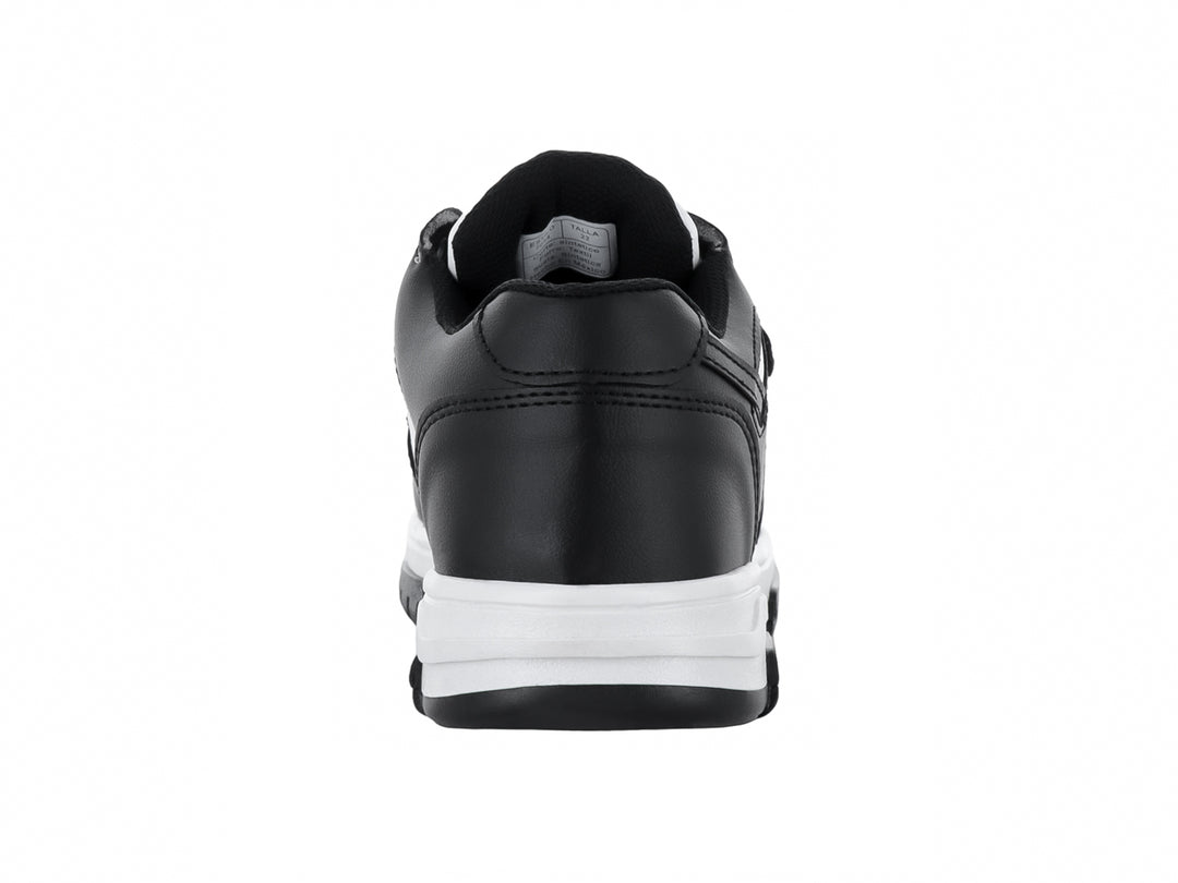 Tenis infantiles de color blanco y negro con cierre de velcro.