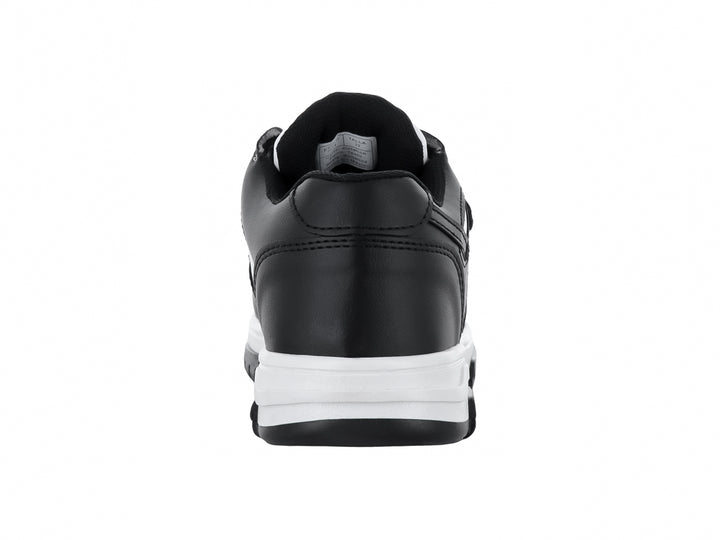 Tenis infantiles de color blanco y negro con cierre de velcro.