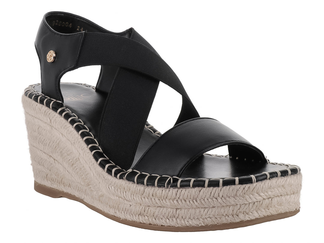 Sandalia de cuña color negro con plataforma de yute beige y correa al tobillo.