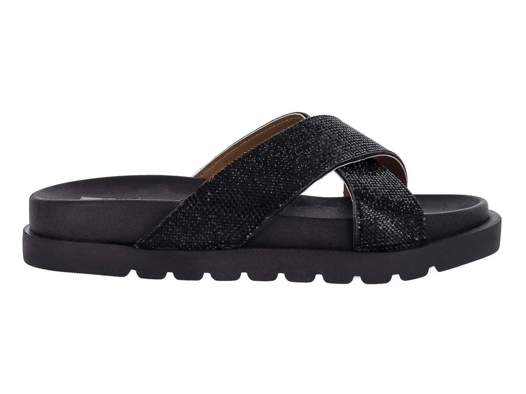 Sandalia negra de plataforma con tiras cruzadas brillantes y suela dentada.