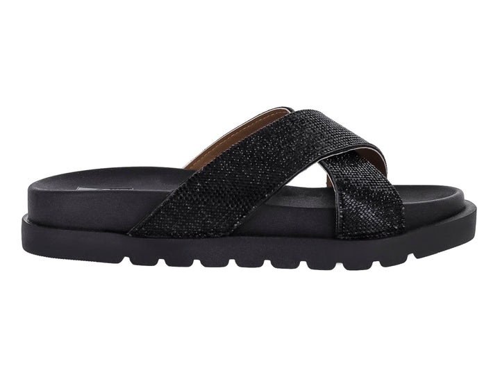 Sandalia negra de plataforma con tiras cruzadas brillantes y suela dentada.