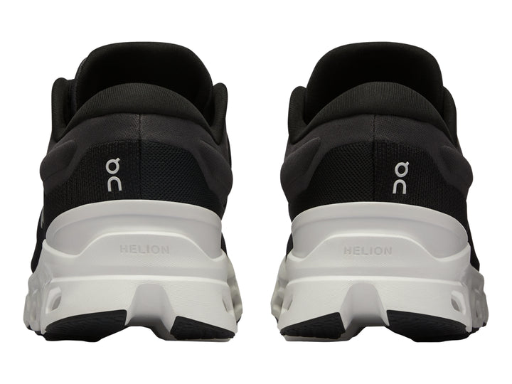 Tenis deportivos On Cloudstratus 3 en color negro con suela blanca gruesa y diseño moderno.