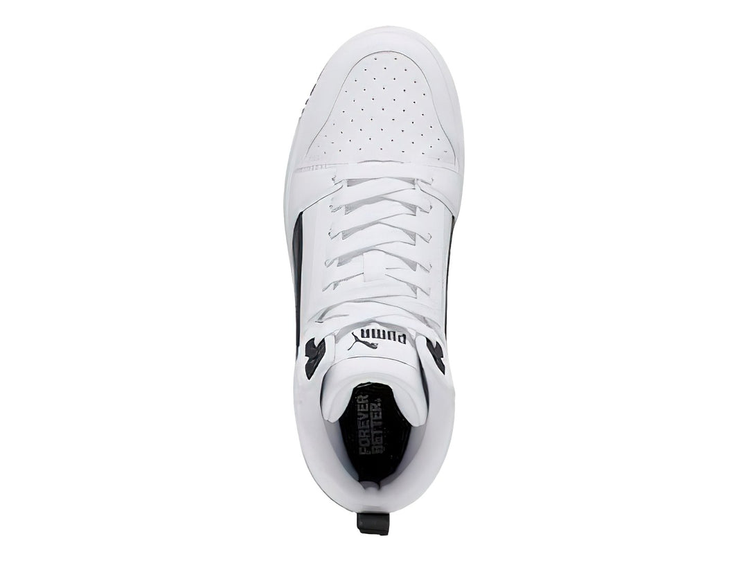 Tenis PUMA Rebound V6 Mid JR color blanco con detalles en negro, diseño de corte medio.