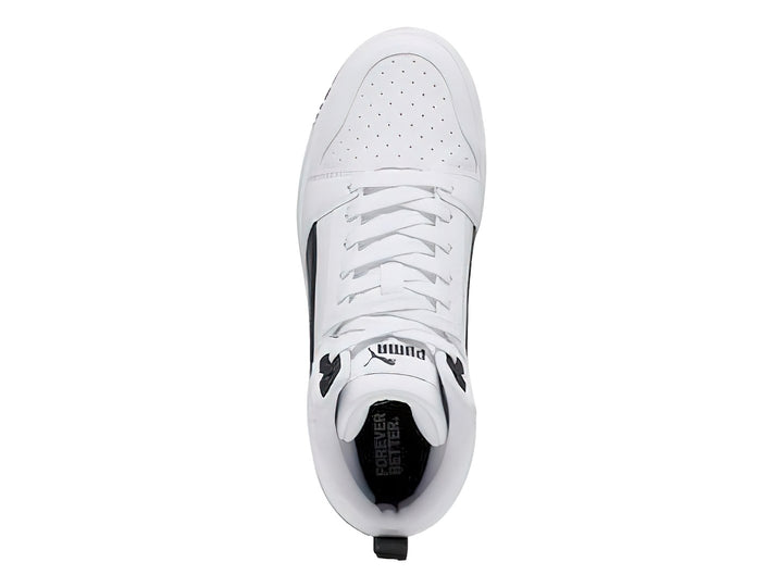 Tenis PUMA Rebound V6 Mid JR color blanco con detalles en negro, diseño de corte medio.