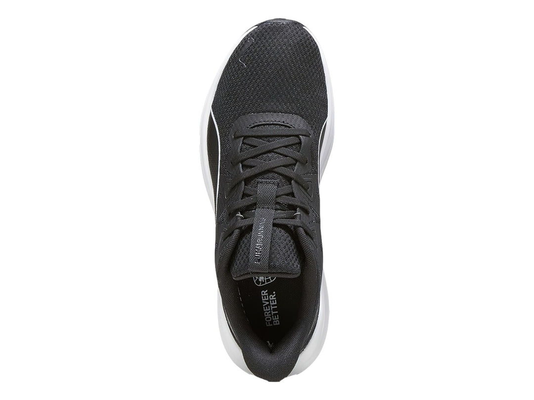 Tenis deportivos PUMA color negro con suela blanca y detalle lateral blanco.