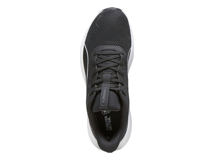 Tenis deportivos PUMA color negro con suela blanca y detalle lateral blanco.