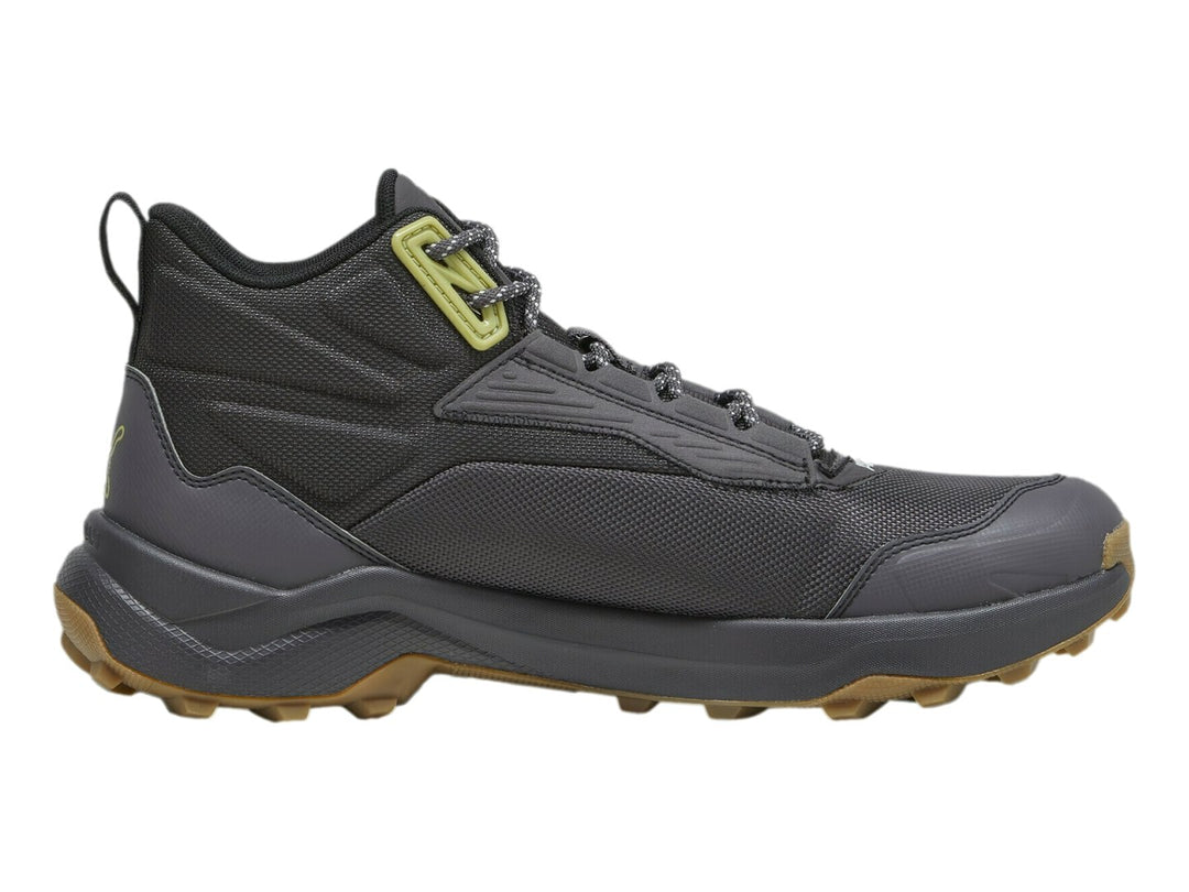 Tenis PUMA Obstruct Pro Mid color gris oscuro con suela de goma y detalles en verde lima.