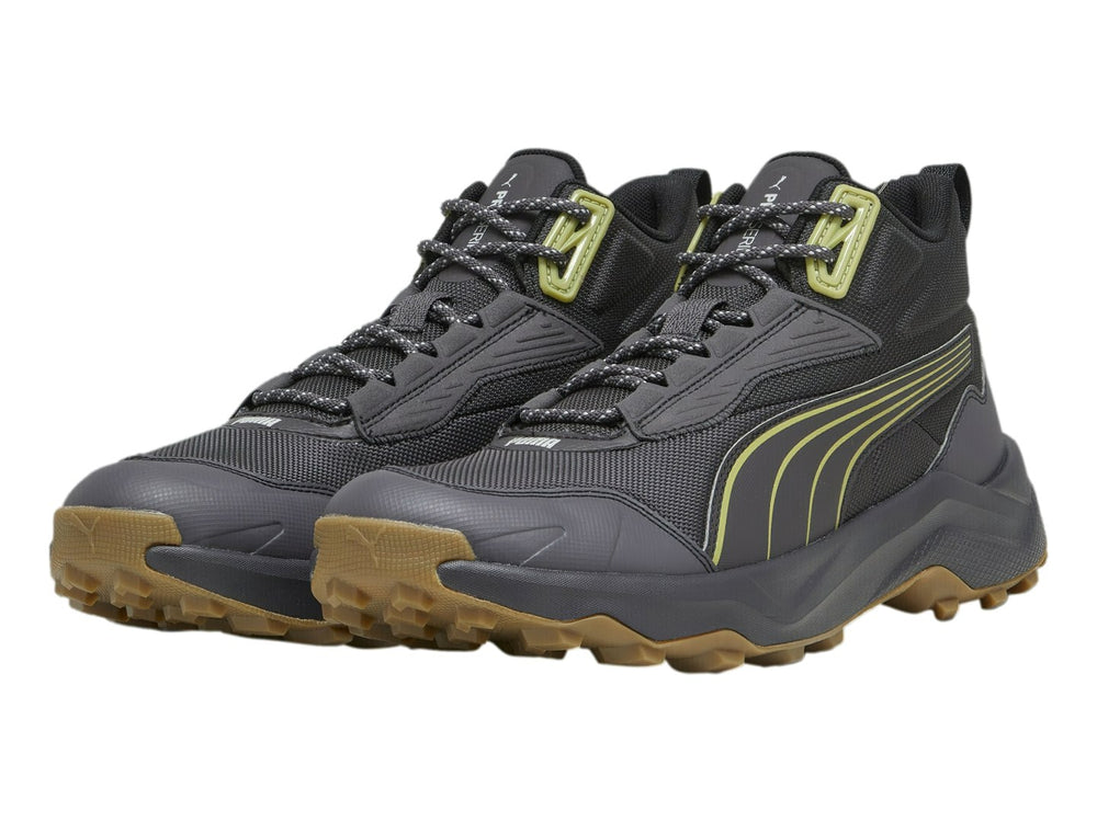 Tenis PUMA Obstruct Pro Mid color gris oscuro con suela de goma y detalles en verde lima.