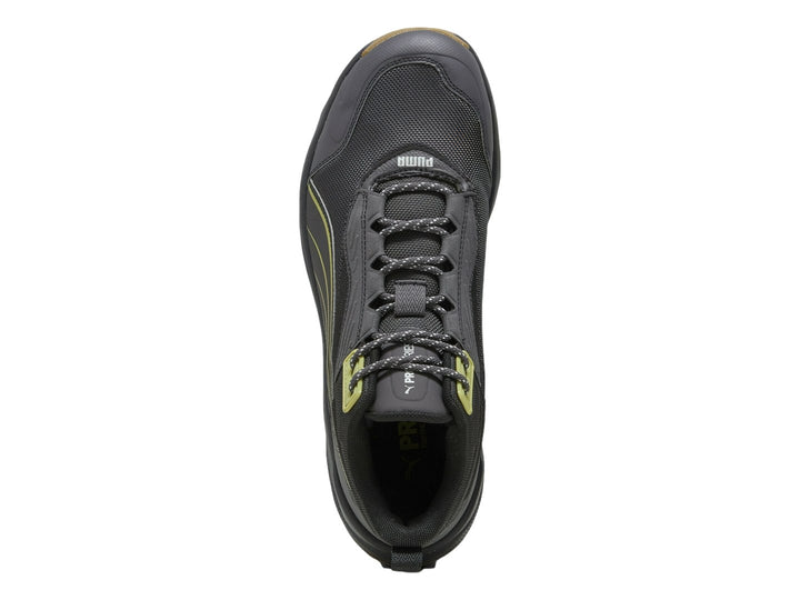 Tenis PUMA Obstruct Pro Mid color gris oscuro con suela de goma y detalles en verde lima.