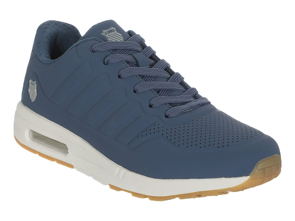 Tenis deportivos K-Swiss color azul con suela blanca y detalles en café, vista lateral.