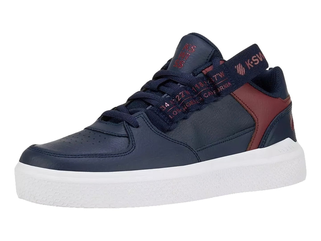 Tenis K-SWISS color azul marino con detalles en rojo y suela blanca.