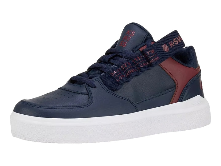 Tenis K-SWISS color azul marino con detalles en rojo y suela blanca.