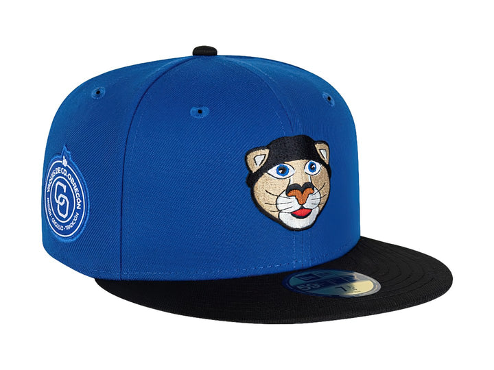 Gorra de béisbol New Era color azul con visera negra y un bordado de cara de animal en el frente.