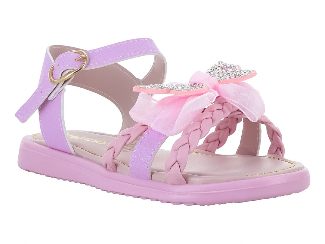 Sandalias rosas para niña con detalle de moño decorado con brillos y correa ajustable dorada.