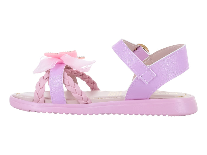 Sandalias rosas para niña con detalle de moño decorado con brillos y correa ajustable dorada.