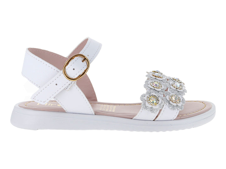 Sandalia blanca para niña con adornos de flores brillantes y hebilla dorada en el tobillo.