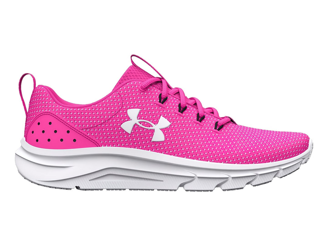 Tenis deportivos Under Armour color rosa rebelde con suela y logotipo en blanco.