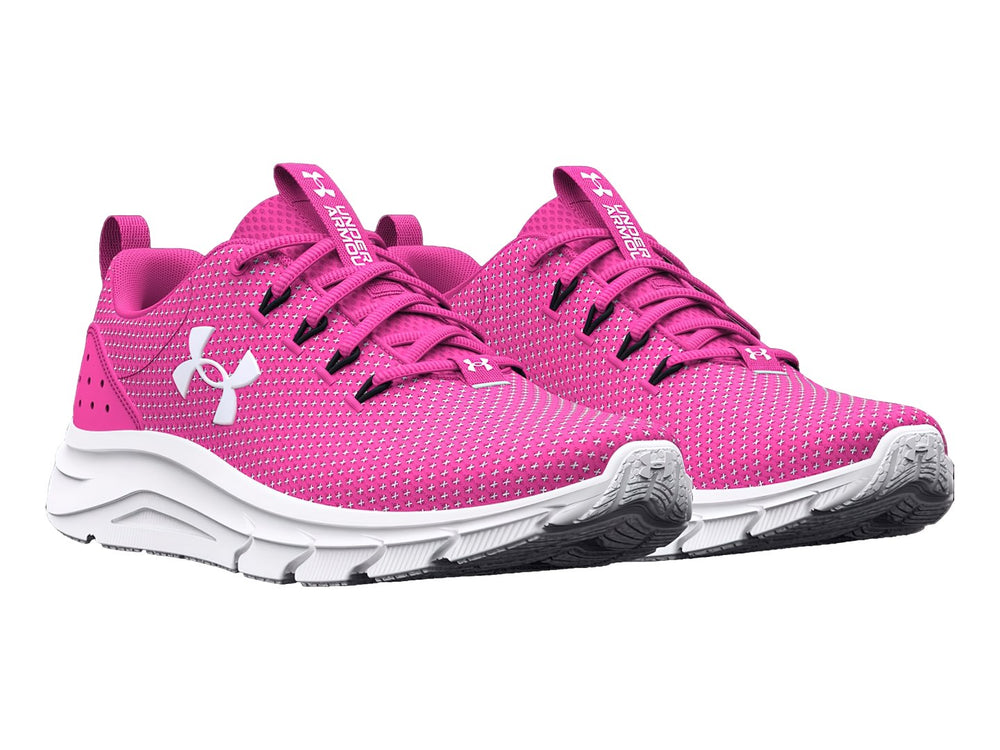 Tenis deportivos Under Armour color rosa rebelde con suela y logotipo en blanco.