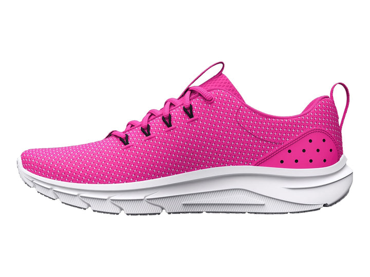 Tenis deportivos Under Armour color rosa rebelde con suela y logotipo en blanco.