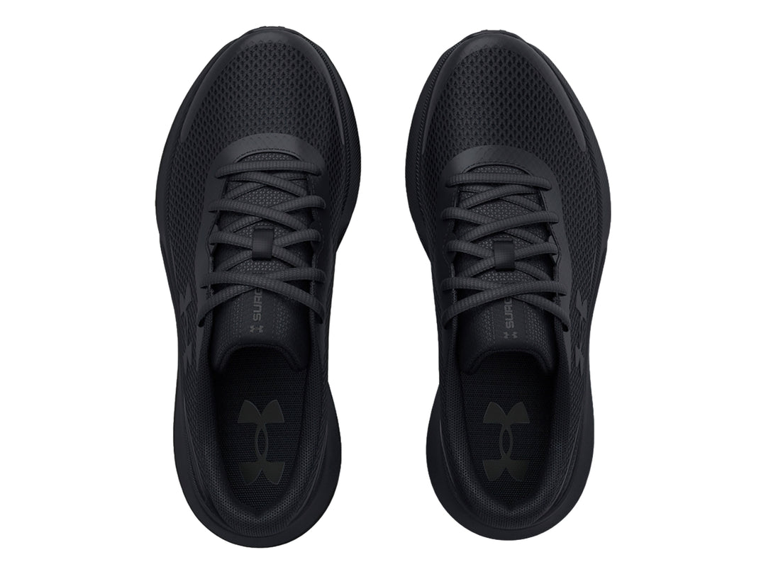 Tenis deportivos Under Armour color negro para niños con malla transpirable y suela cómoda.