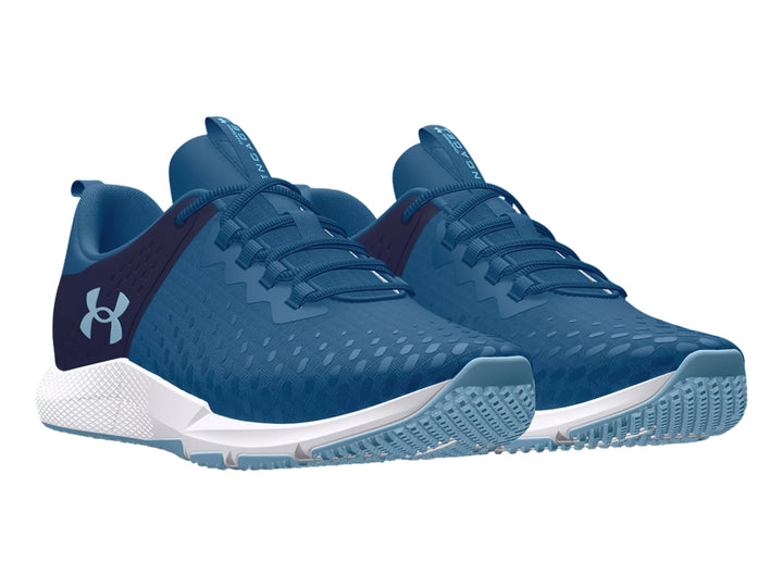 Tenis deportivos Under Armour color azul con suela blanca y detalles en azul marino.