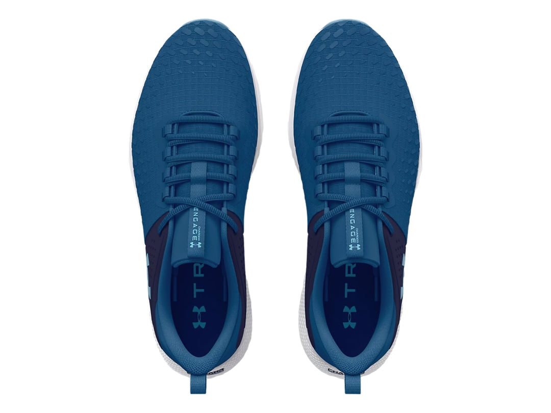 Tenis deportivos Under Armour color azul con suela blanca y detalles en azul marino.