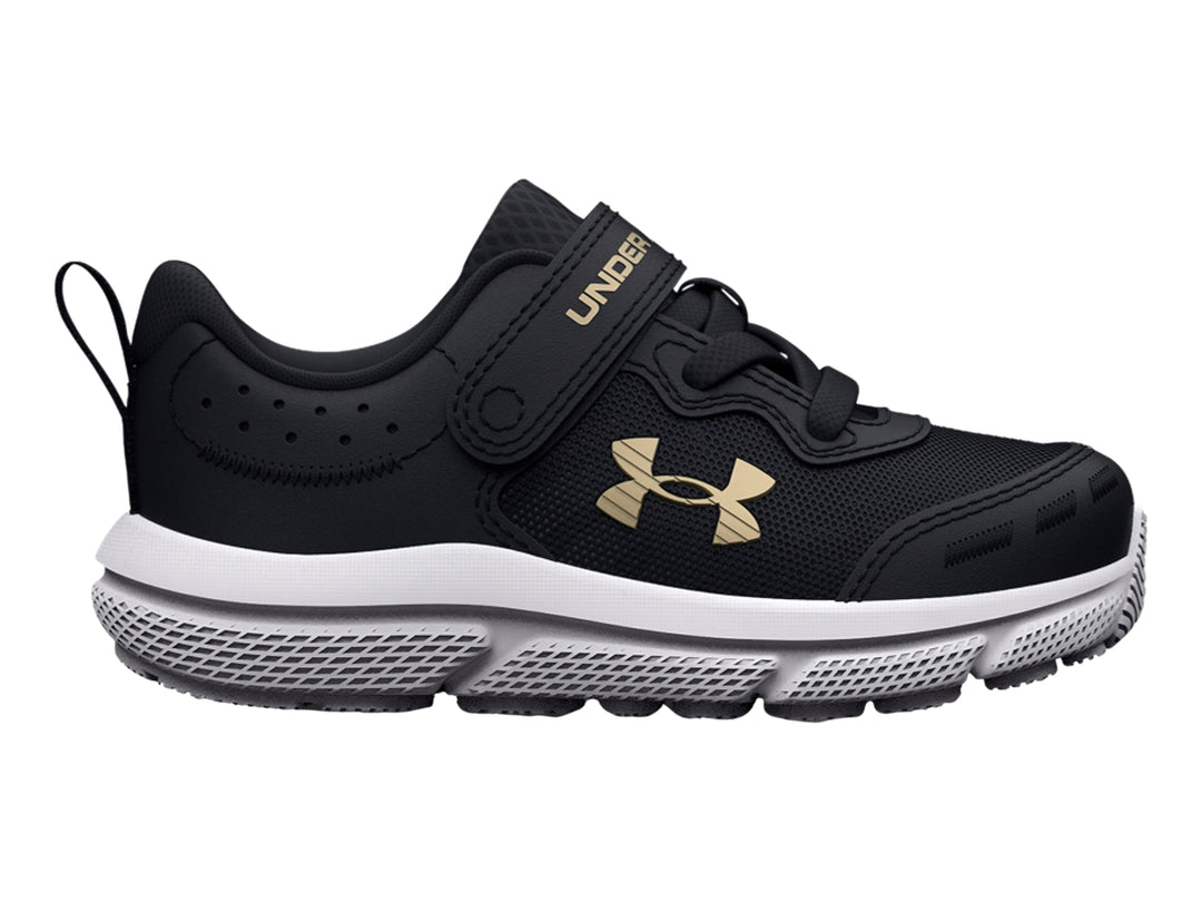 Tenis deportivos Under Armour color negro con suela blanca y logo dorado.