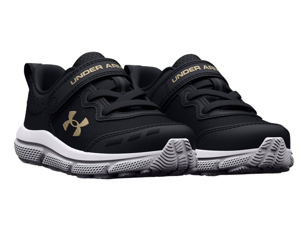 Tenis deportivos Under Armour color negro con suela blanca y logo dorado.