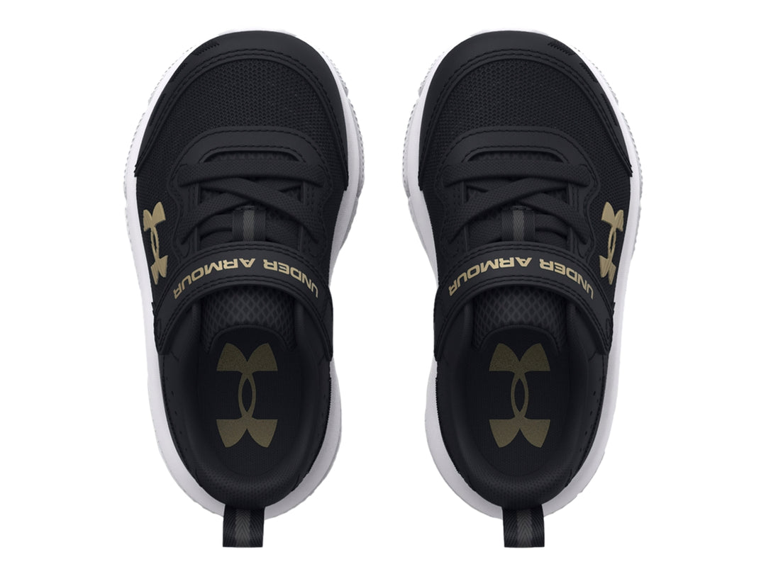 Tenis deportivos Under Armour color negro con suela blanca y logo dorado.