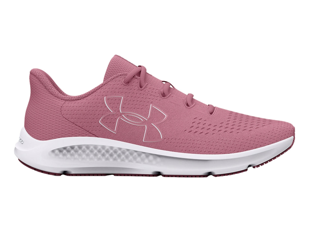 Tenis deportivos Under Armour color rosa con suela blanca y logotipo lateral blanco.