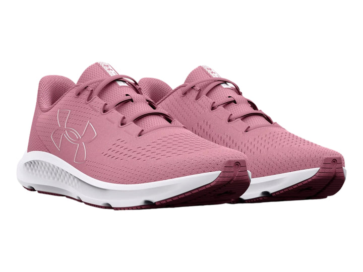 Tenis deportivos Under Armour color rosa con suela blanca y logotipo lateral blanco.