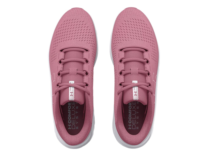 Tenis deportivos Under Armour color rosa con suela blanca y logotipo lateral blanco.