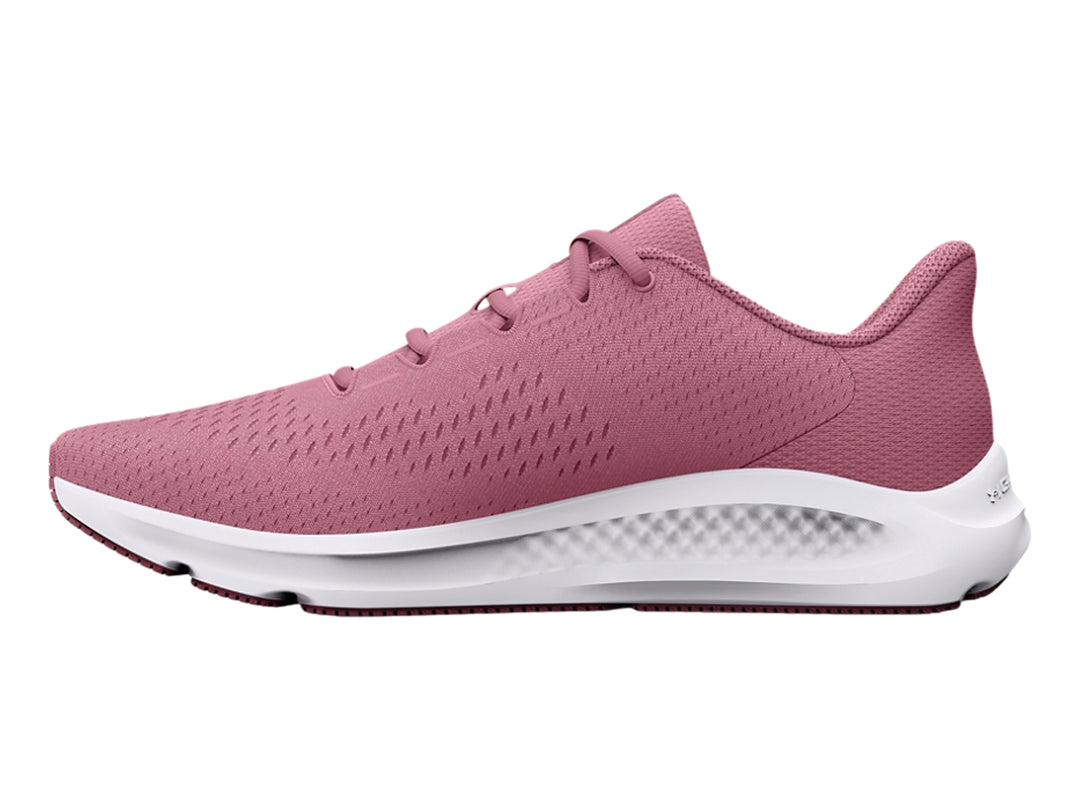 Tenis deportivos Under Armour color rosa con suela blanca y logotipo lateral blanco.