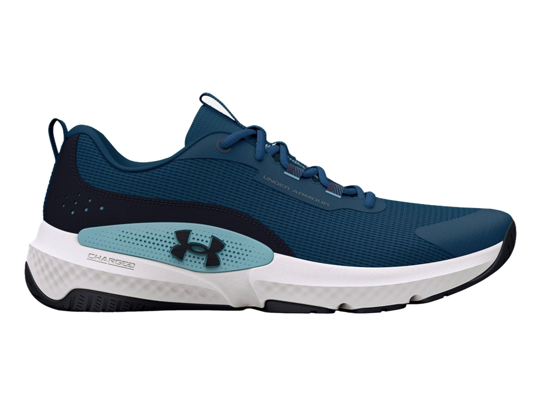 Tenis deportivos Under Armour color azul con suela blanca y detalles en azul claro.