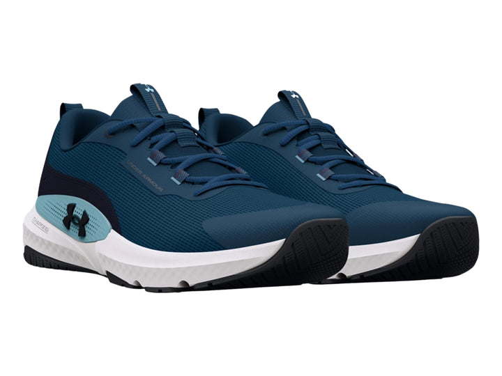 Tenis deportivos Under Armour color azul con suela blanca y detalles en azul claro.