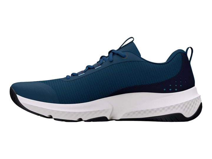 Tenis deportivos Under Armour color azul con suela blanca y detalles en azul claro.
