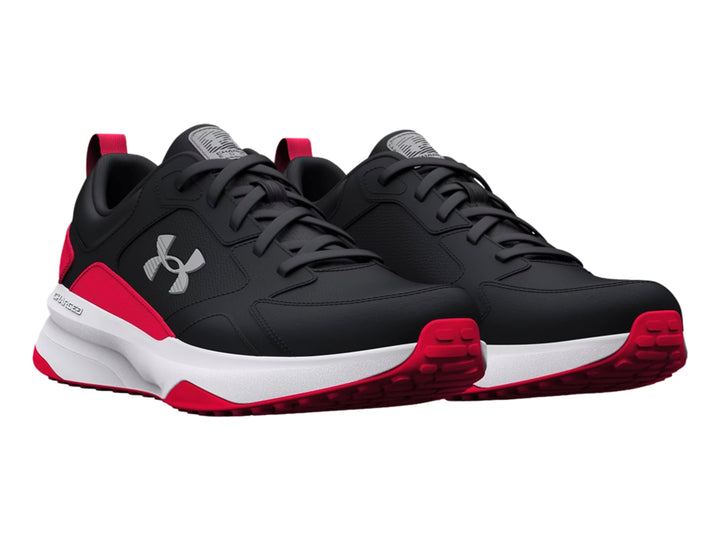 Tenis deportivos Under Armour color negro con detalles en rojo y suela blanca.