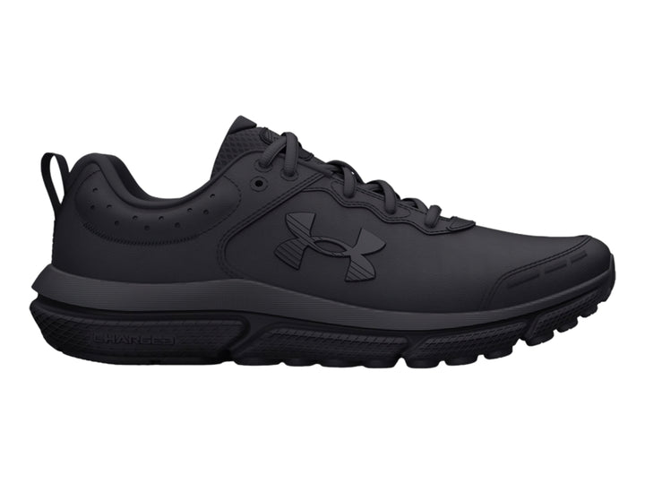 Tenis deportivos Under Armour color negro total para niños, vista lateral.