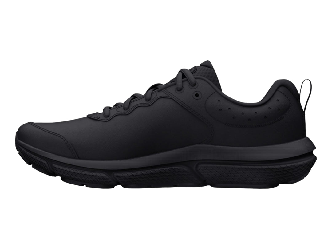 Tenis deportivos Under Armour color negro total para niños, vista lateral.