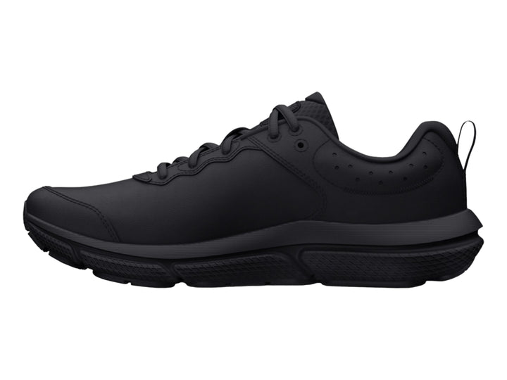 Tenis deportivos Under Armour color negro total para niños, vista lateral.