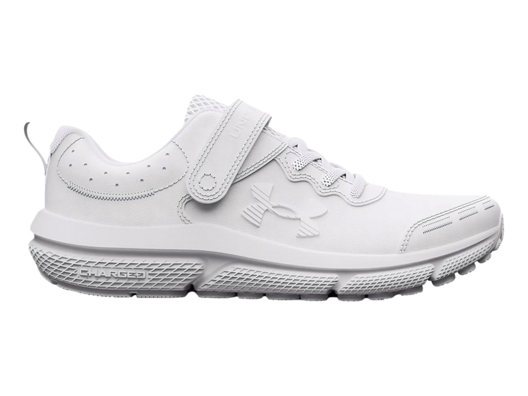 Tenis deportivos Under Armour color blanco con cierre de velcro y cordones para niño.