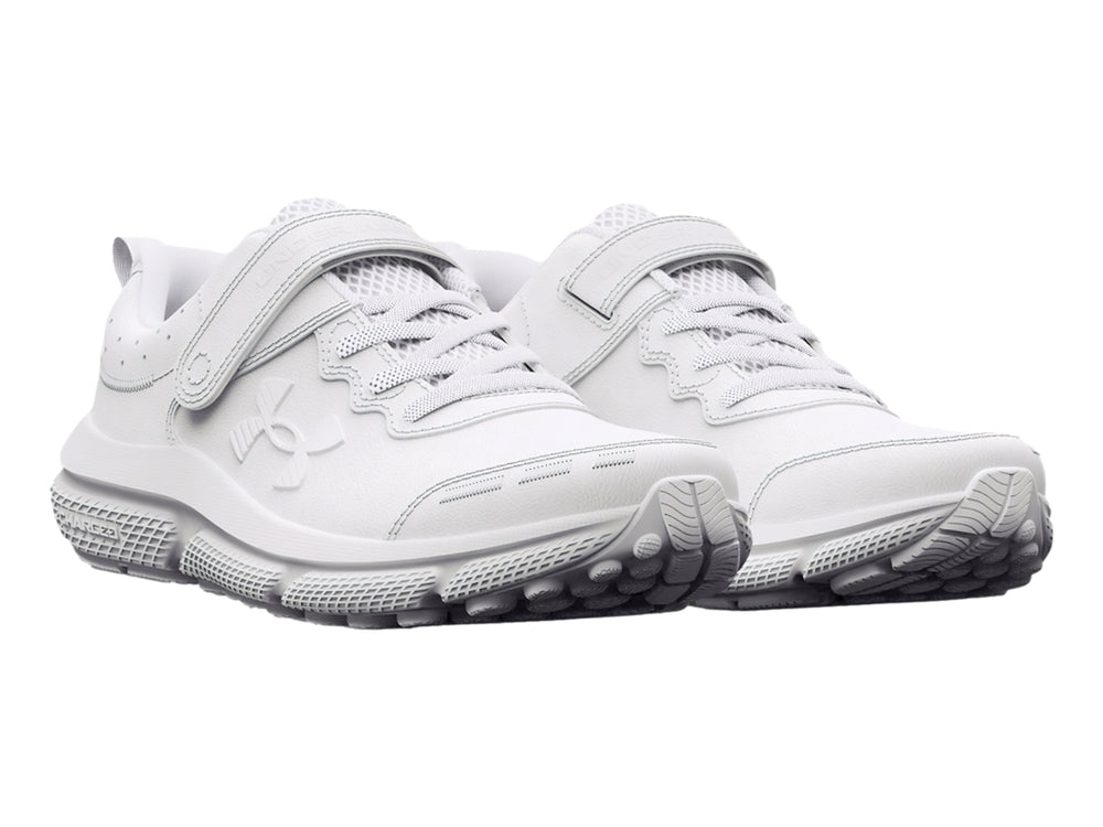 Tenis deportivos Under Armour color blanco con cierre de velcro y cordones para niño.
