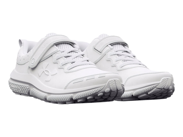 Tenis deportivos Under Armour color blanco con cierre de velcro y cordones para niño.