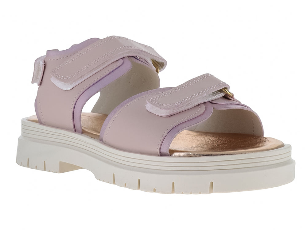 Sandalia infantil color rosa con suela blanca gruesa y correas de ajuste con velcro.