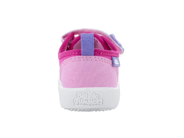 Zapato infantil color fucsia con suela blanca, cierres de velcro y texto &