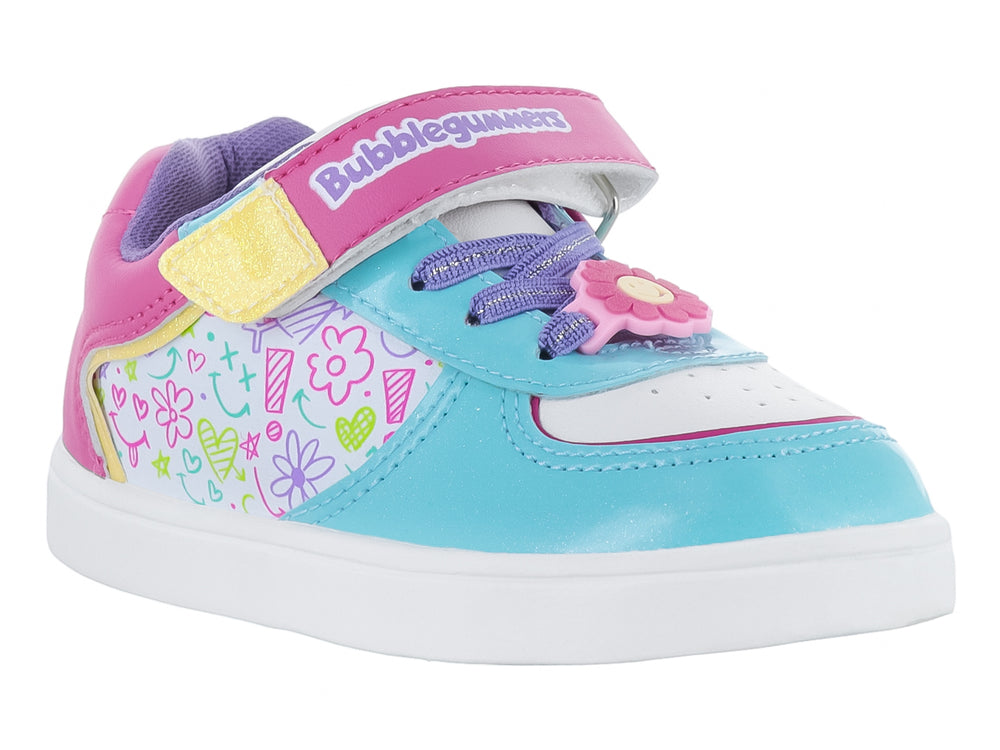 Tenis infantiles multicolor en tonos fucsia y menta con cierre de velcro y estampados decorativos.