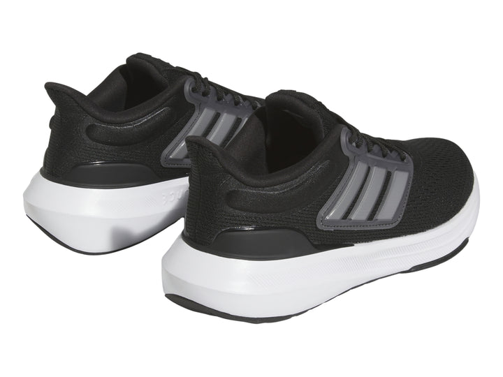 Tenis deportivos Adidas Ultrabounce en color negro con suela blanca y detalles grises para niño.