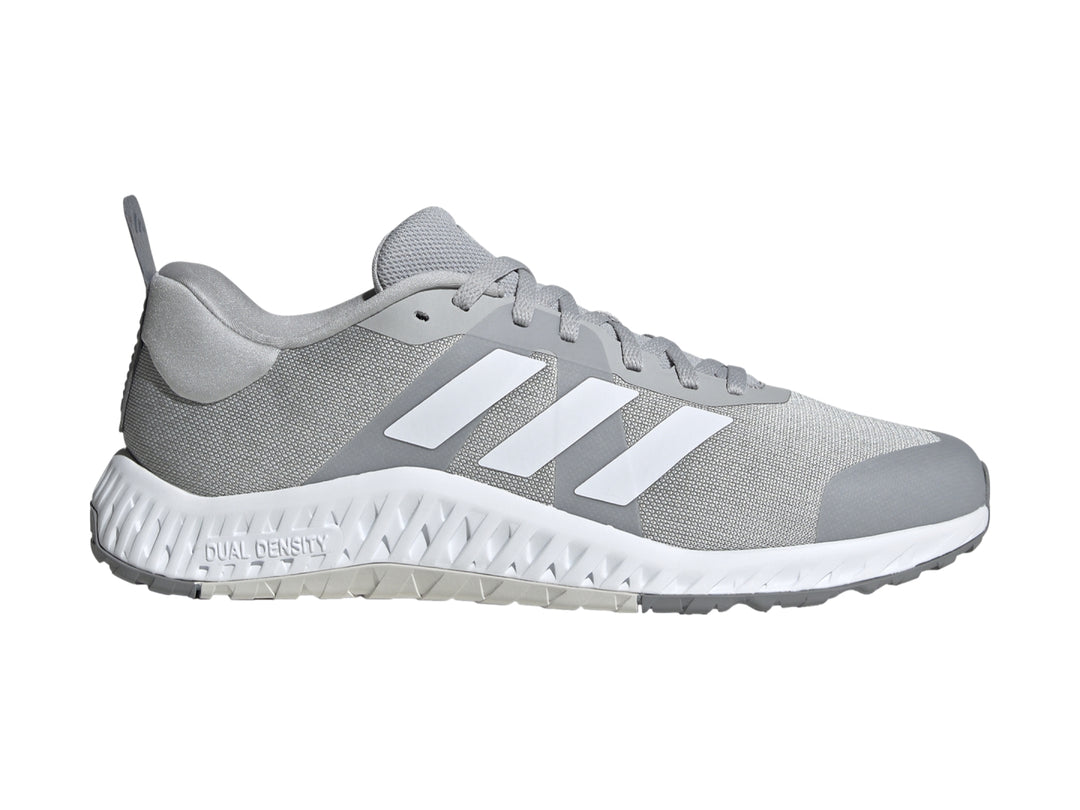 Tenis deportivos Adidas en color gris con franjas blancas y suela blanca Dual Density.