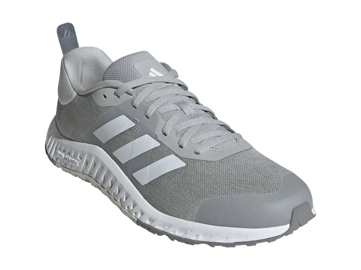 Tenis deportivos Adidas en color gris con franjas blancas y suela blanca Dual Density.