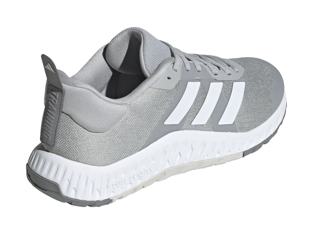 Tenis deportivos Adidas en color gris con franjas blancas y suela blanca Dual Density.
